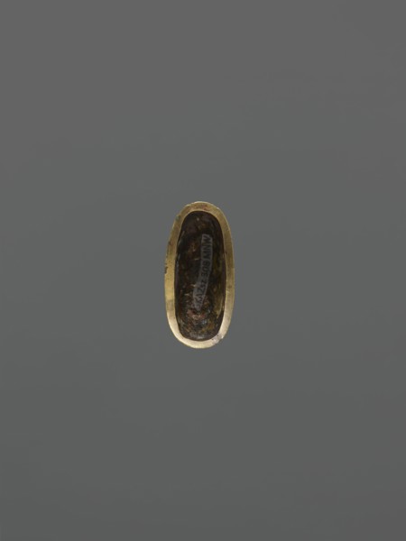 String threading knob kurigata, Japanese, katana scabbard decorative element; depicts deer, leaves,