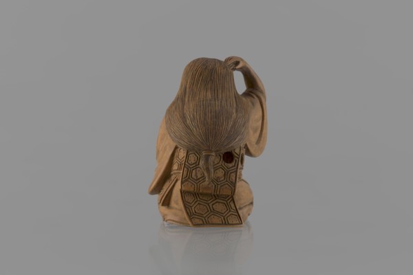 Netsuke in the shape of a nô theater actor wearing an Okame mask, Hôjitsu fl. ca. 1800–1860