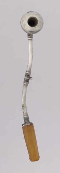 Pipe for smoking hashish. The stem is slightly curved, thin, ending with a flattened amber,