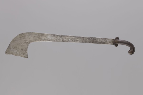 Sabre of the bark type, With a curved hilt and similar expanded engraving. Decorated with