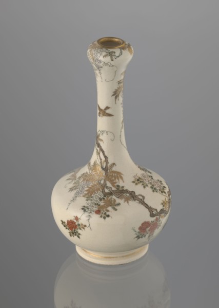 Onion-shaped vase with a low ring foot and long slender neck bulging at the spout, decorated with a
