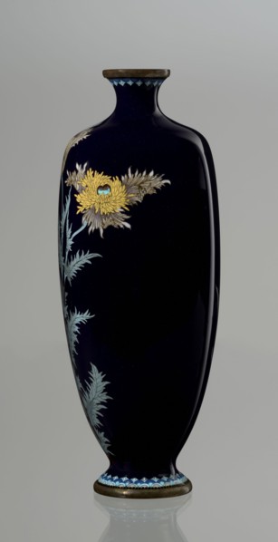 Angular vase one of a pair with rounded edges, on a low round foot and with a short neck slightly