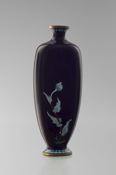 Angular vase one of a pair with rounded edges, on a low round foot and with a short neck slightly