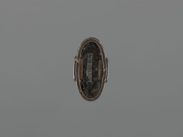 Sword hilt cap kashira, ; subject: flowers and twigs; materials/technique: grained background with