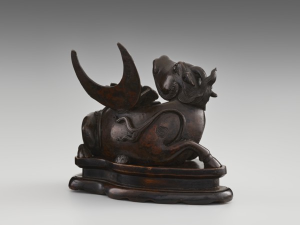Mirror pedestal — lying unicorn on base; carved wooden base; qilin unicorn iconography; crescent