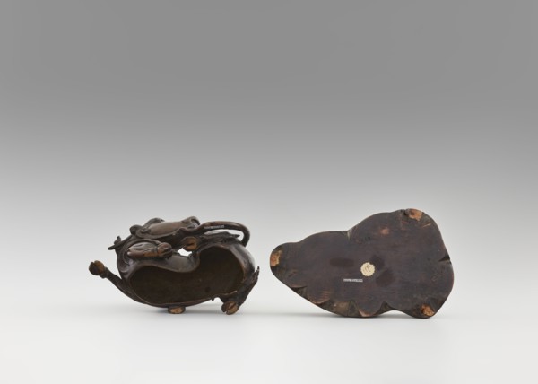 Mirror pedestal — lying unicorn on base; carved wooden base; qilin/unicorn iconography; crescent