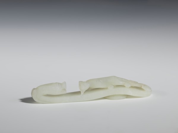 Belt clasp, Chinese, Qing dynasty 1644–1911. 18th–19th century. Milky-white jadeite, slightly
