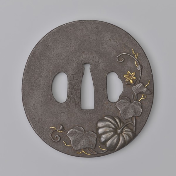Crossguard tsuba, Masayoshi. Round tsuba maru gata with a rectangular edge kaku mimi, decorated on