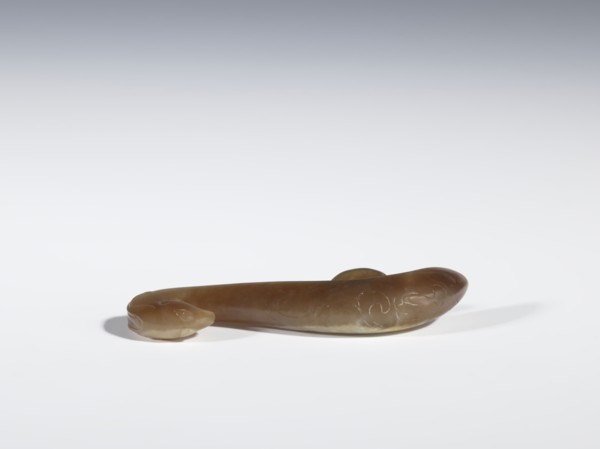 Belt clasp, Chinese, Qing 1644–1911, 18th–19th century. Brown jade with lighter spots, full-plastic