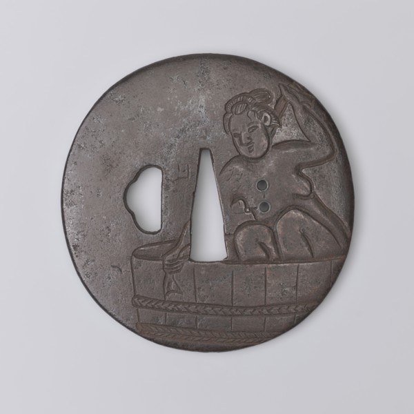 Crossguard tsuba, Yoriie,  ; engraved decoration depicting a naked woman bathing in a large tub and
