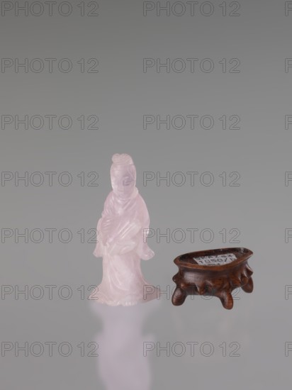 Guanyin on a base; figurine carved in rose quartz; full sculpture with engraving; Chinese; Qing