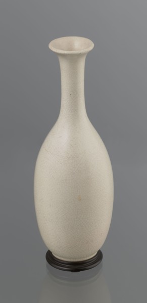 Vase on saucer. Vase made of stoneware or thick porcelain?, ovoid with a long cylindrical neck,