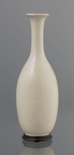Vase on saucer. Stoneware or thick porcelain?, ovoid with a long cylindrical neck flaring at the