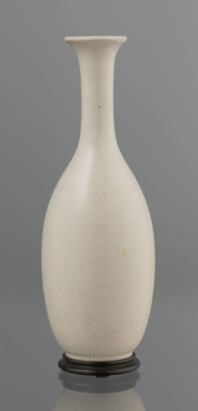 Vase on saucer. Vase made of stoneware or thick porcelain?, ovoid with a long cylindrical neck