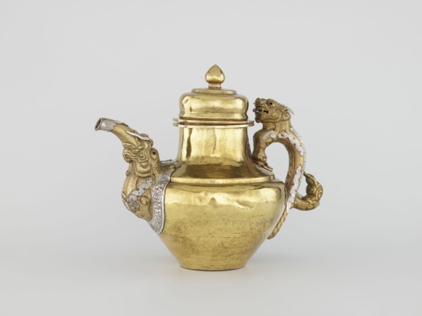 Teapot, Tibetan, 19th century. Jug with a lid on a chain; dragon-shaped handle, spout probably in