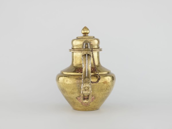 Teapot, Tibetan, 19th century. Jug with a lid on a chain; dragon-shaped handle, spout probably in