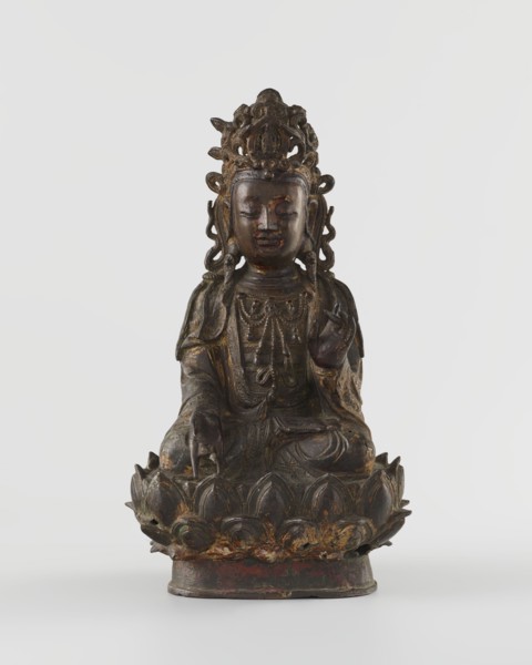 Guanyin, unknown creator; sculptor unknown. Chinese Buddhist bodhisattva figurine on a lotus throne