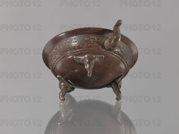 Ding vessel, Ding vessel with three legs and two handles. Used for ritual hand washing. Bronze.