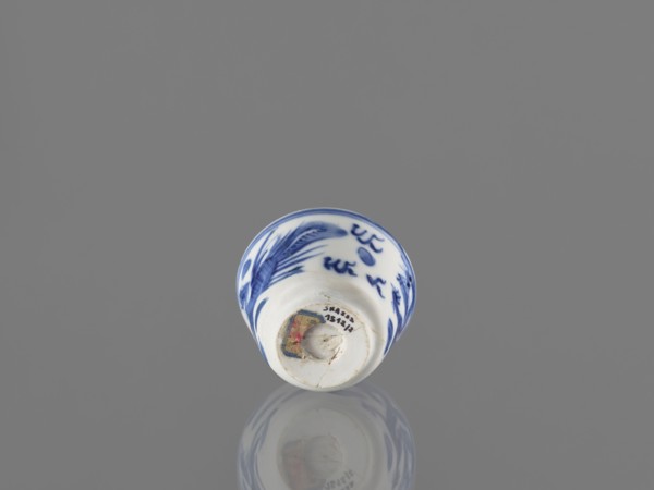 Bowl; Chinese; 19th century. Blue-and-white porcelain vessel decorated with dragons, phoenixes