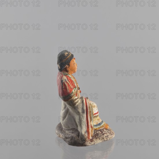 Figurine of a seated man; creator, Chinese; Chinese art; ceramics; male clothing; seated figure;