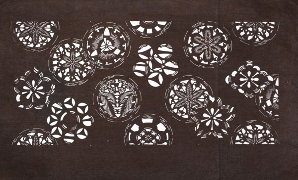 Katagami dyeing stencil with a motif of stylized floral rosettes and cherry blossoms kawari kamon