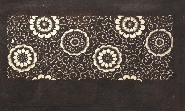 Katagami dyeing stencil with a motif of stylized flower rosettes and plant tendrils kawari kamon ni