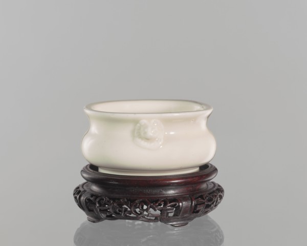 Table stand, shallow recessed base on four feet; geometric and plant ornament; Chinese; Qing