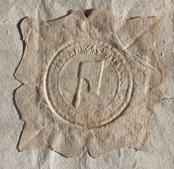 Round seal impression of the town of Bobrowniki, Stezyca region. The Topór (Axe) coat of arms is on