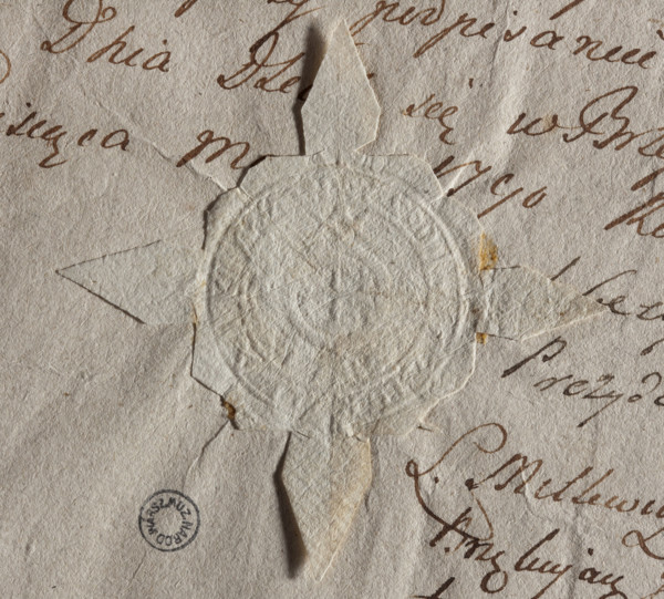 Round seal impression of the city of Brzesc Kujawski. In the rim an equal-armed cross. The rim
