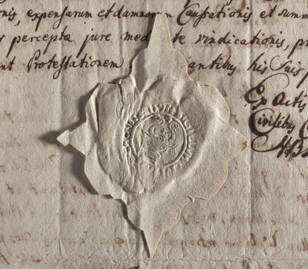 Round seal impression of the town of Chojnice. Ox head with curled horns. Between the horns and on