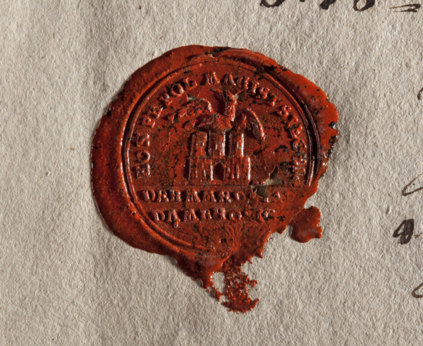 Round wax impression of the town seal of Dombrowice (Dabrowice). In the upper field a wall with an