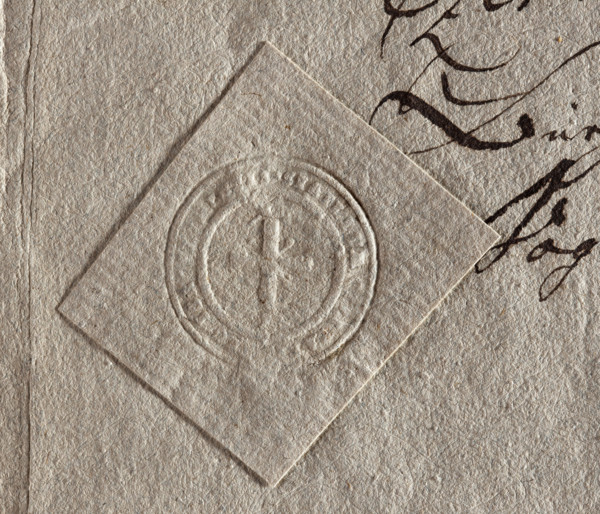 Round seal impression of the town of Góra Kalwaria. A cross on the hill. Illegible inscription on