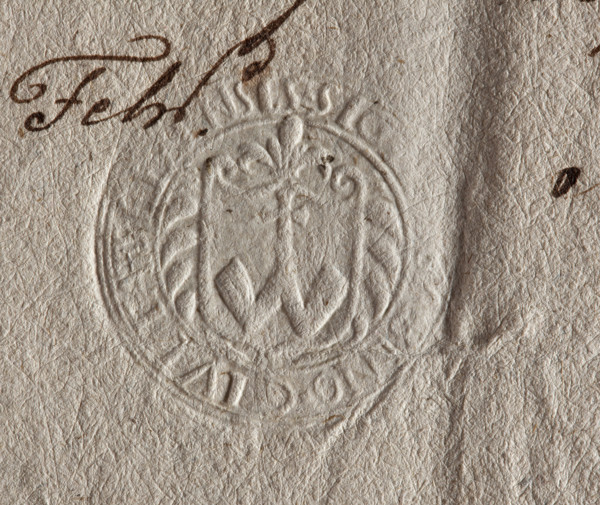 Round seal impression of the town of Ilza. On the baroque shield the Abdank coat of arms with a