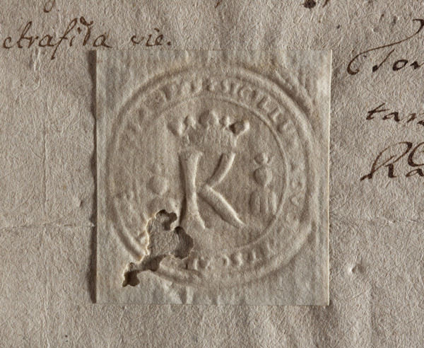 Imprint of the seal of Kazimierz. Under the royal crown, the letter K. On the sides, two busts with