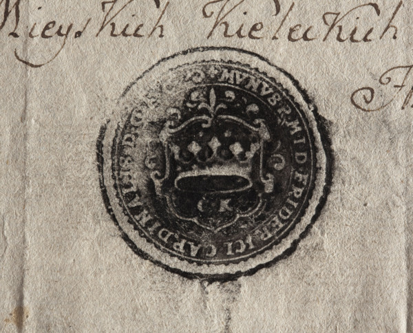 Round ink print of the seal of the city of Kielce. On the decorative shield a crown; under it the