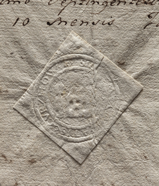 Round seal impression of the town of Kurzelów. Illegible drawing (gate with a tower?). Illegible