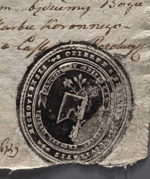 Oval print of the seal of the town of Miechów. Axe with a rose branch entwined around the axe
