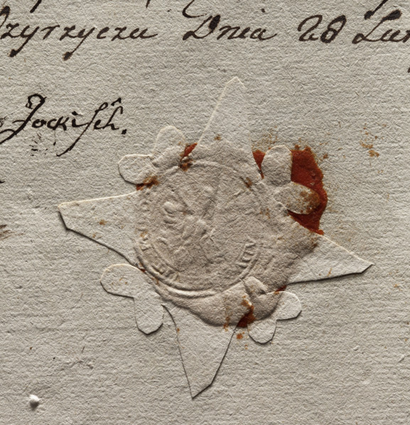 Round seal impression of the town of Miedzyrzecz. In the central part of the seal, an illegible