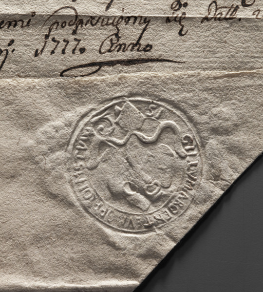 Round seal impression of the town of Mstów. Under the bishop's mitre, a baroque cartouche with two