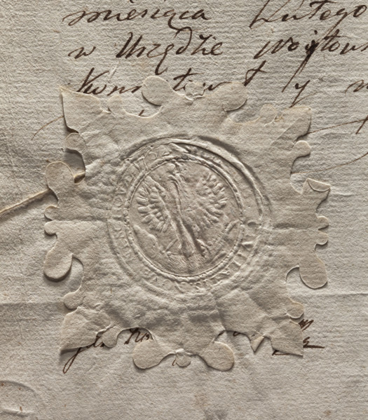Round seal impression of the town of Nieszawa. A crowned eagle holding a large fish in its talons.