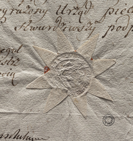 Round seal impression of the town of Odolanów. In an oval decorative cartouche an illegible drawing