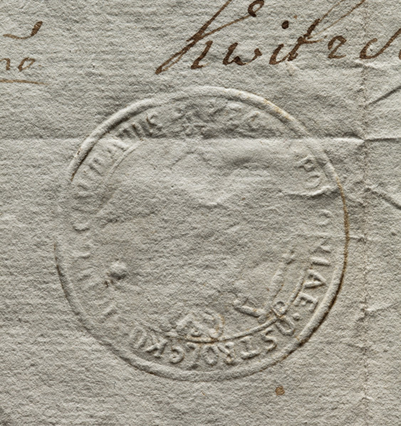 Round seal impression of the town of Ostroleka, poorly legible. Eagle holding a scepter and an orb