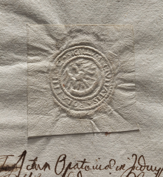 Round imprint of the seal of the town of Polaniec. Royal eagle standing, holding a horn in its