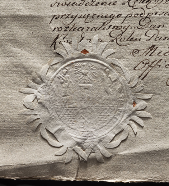 Circular imprint of the seal of the city of Poznan. City wall with an open gate, within it two