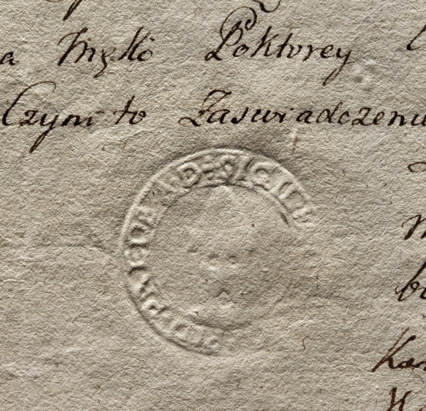 Oval seal impression of the town of Przedbórz. Two crenellated towers with crowns above, a third