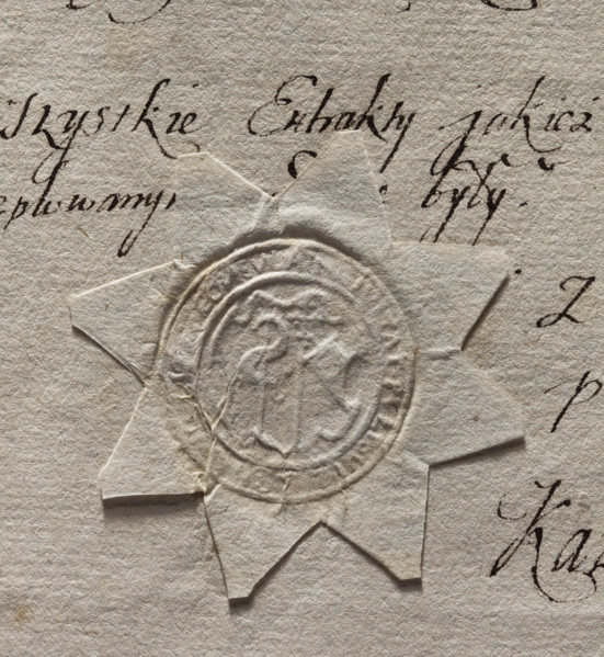 Round seal impression of the town of Pultusk. In a decorative cartouche, a cross with a pennant and