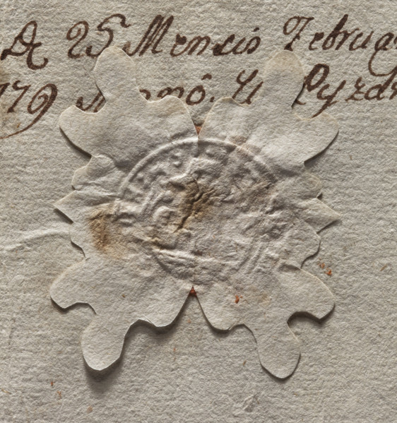 Round seal impression of the town of Pyzdry. Central drawing and inscription illegible. Depicts a