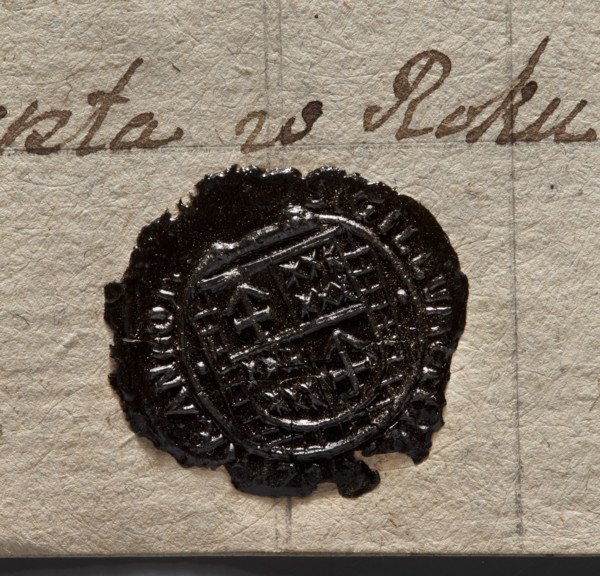 Round wax impression of the seal of the town of Rydzyna. On the field, a shield divided quarterly: