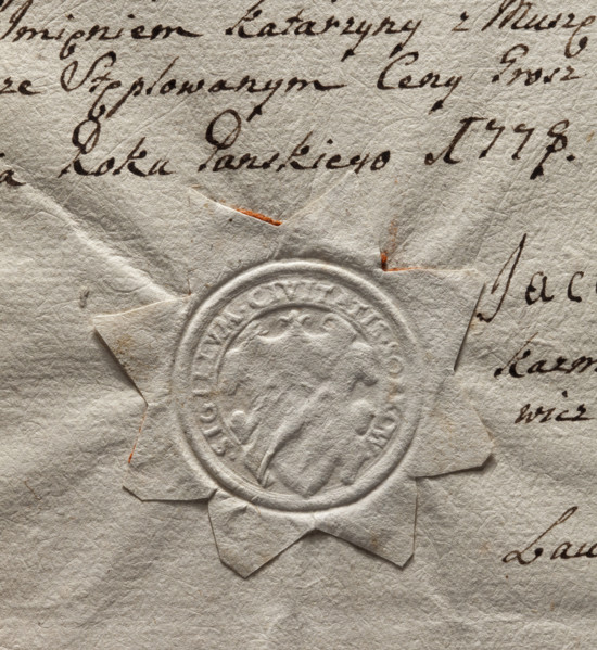 Round imprint of the seal of the town of Sobków. Illegible drawing in the decorative cartouche.