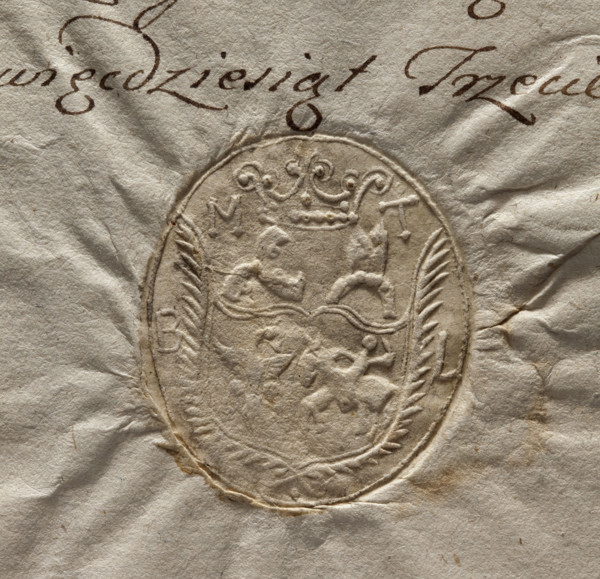 Oval seal impression of the town of Torczyn, Lutsk district. Beneath the noble crown, a shield